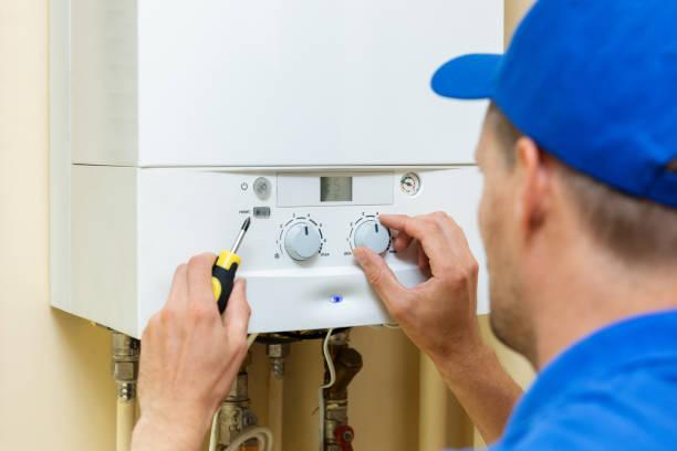 Gas Safe engineer installing a boiler